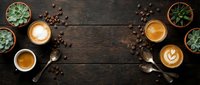 Coffee cups with latte art and succulents on rustic wooden table. Flat lay composition with espresso, cappuccino and roasted beans for cafe menu design.