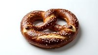 Freshly baked soft pretzel with coarse salt crystals on golden-brown twisted dough, isolated on white background for bakery, food packaging and culinary design projects.