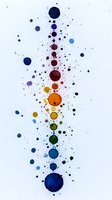 Colorful watercolor drops and splatters forming vertical line on white background. Rainbow spectrum of blue, purple, red, orange, yellow and green circular paint stains.