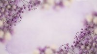 Delicate purple flowers create soft romantic border frame on light background with dreamy bokeh effect for wedding invitations and feminine designs.