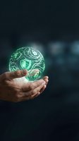 Hands holding glowing green cybersecurity sphere with shield icons representing digital protection and data security technology concepts.