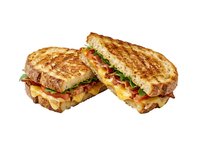 Grilled cheese sandwich with tomato and lettuce filling, toasted bread slices, isolated on white background for food service, restaurant menus, culinary websites.