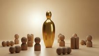 Golden leader figure standing prominently among wooden team members representing leadership, teamwork and business hierarchy concepts.