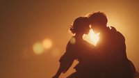 Romantic couple silhouette embracing at golden sunset with warm bokeh lights creating intimate atmosphere for love and relationship concepts.