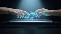 Two hands reaching toward each other with glowing blue digital energy connection above tablet screen representing technology collaboration and innovation.