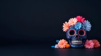 Dark blue sugar skull decorated with pink, peach and blue flowers against black background, celebrating Day of the Dead tradition. Mexican folk art style on dramatic backdrop.
