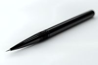 Elegant black fountain pen tip isolated on white background, dramatic lighting emphasizes sleek design and metallic texture. Professional writing instrument.