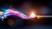 Burning match with magical colorful smoke trail creating ethereal waves of purple, blue and orange light against dark background, glowing particles floating in air.