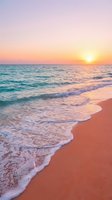Serene coastal landscape featuring soft waves rolling onto sandy shore at sunrise, with pastel pink and golden sky reflecting on calm ocean waters for travel and nature projects.