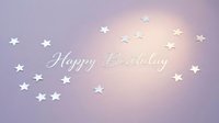 Happy Birthday greeting card with silver stars on a soft purple pastel background, glowing light effect for celebration design.