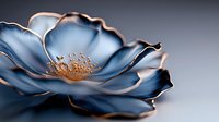 Elegant blue flower with golden center on dark background, metallic petals with copper edges create dramatic artistic composition for luxury decor and design projects.
