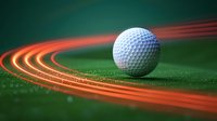 White golf ball on green surface with glowing orange light trails creating dynamic motion effect. Sports equipment close-up on textured grass background.