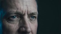 Middle-aged Caucasian male with blue eyes, furrowed brow, and concerned expression. Close-up portrait suitable for healthcare, mental health, stress, anxiety, depression, and emotional well-being content.