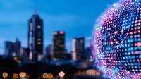 Digital network sphere with glowing pink and blue connections against blurred urban skyline and city lights at dusk, representing global connectivity and smart city concept.