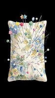 Watercolor floral pincushion with colorful sewing pins and needles, isolated on transparent background, ready for t-shirt design, stickers, clipart, and print on demand.