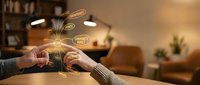 Young professional woman using smartphone with glowing social media icons floating above device in cozy modern living room interior for digital marketing concepts.