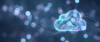 Glowing cloud computing icon with flowing data streams and bokeh lights on dark blue background for technology and digital transformation concepts.