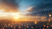 Dramatic cityscape silhouette at sunset with glowing bokeh particles floating in foreground creating magical atmospheric urban scene against orange sky.