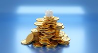 Golden coins stacked in pyramid formation with glowing lightbulb on top representing financial innovation, investment ideas, and wealth building strategies.