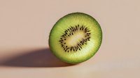 Fresh kiwi fruit slice showing vibrant green flesh and black seeds on neutral background for healthy eating and nutrition concepts.