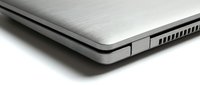 Slim silver laptop closed on white background, showcasing brushed aluminum texture and sleek modern design for technology and business concepts.