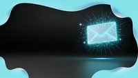 Glowing email envelope with sparkling light effects on dark surface for digital communication and marketing concepts.