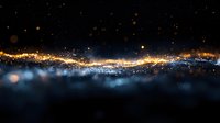 Magical glowing particles and sparkles floating in dark space with golden light trail and blue bokeh effect creating ethereal atmosphere.