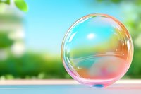 Transparent soap bubble with rainbow iridescent reflections floating against blurred green nature background, showing delicate surface tension and light refraction.