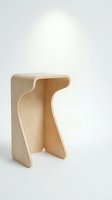 Modern wooden stool with curved organic design on white background. Minimalist furniture piece crafted from natural wood with smooth flowing lines.