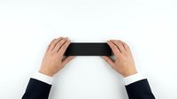 Business hands holding black smartphone on white background for mobile app presentation and digital communication concepts.