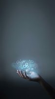 Hand holding glowing cloud computing network with gears and digital icons, representing data management, technology infrastructure, and IT solutions for business applications.