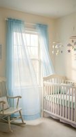 Serene nursery room with white wooden crib, light blue sheer curtains, wooden rocking chair, and hanging mobile with stars and clouds for newborn and infant bedroom decor.