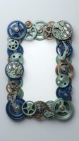 Steampunk mechanical gears frame border with vintage clockwork parts in blue and green tones isolated on white background for industrial design projects.
