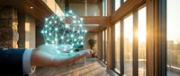 Businessman hand holding glowing digital network sphere with connected nodes in modern office environment representing global connectivity and technology solutions.