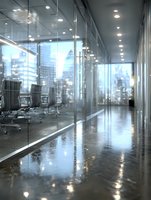Modern office corridor with glass walls and polished floors reflecting city skyline through windows creating professional corporate atmosphere.