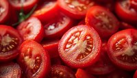 Fresh red cherry tomatoes cut in halves showing juicy pulp and seeds in macro photography. Natural organic produce background for cooking and food design.