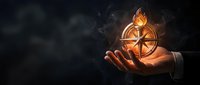 Businessman hand holding glowing compass with flame on dark background symbolizing guidance, direction and leadership in corporate strategy.