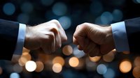 Business handshake between two professionals in formal suits against blurred bokeh lights background symbolizing partnership agreement and cooperation.