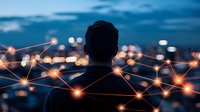 Silhouette of man against city lights with glowing network connections overlay representing digital transformation and connectivity in modern business world.