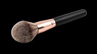 Makeup brush with soft bristles, rose gold ferrule, and black handle isolated on transparent background. Ready for beauty product design, clipart, sublimation, and print-on-demand applications.