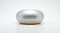 Sleek silver metallic oval pod with gold base accent, isolated on white background for product design, packaging mockups, and tech applications.