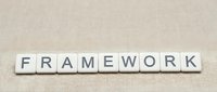 White letter tiles spelling FRAMEWORK on beige textured surface for business strategy and organizational structure concepts.