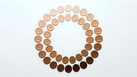 Circular arrangement of foundation makeup samples showing diverse skin tone spectrum from light to dark shades for inclusive beauty and cosmetic matching.
