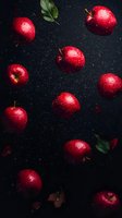 Fresh red apples with water drops floating on dark background with green leaves. Dramatic food photography with natural lighting and moody atmosphere.
