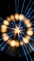 Explosive energy burst with radiating blue and golden light rays emanating from central impact point, creating dynamic motion effect for sci-fi, technology, and abstract design projects.