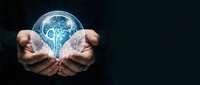 Hands holding a glowing crystal sphere with a luminous brain inside, symbolizing artificial intelligence, innovation, and the power of human mind.