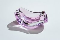 Pink glass abstract curved bowl with soft shadow on white background, modern minimalist design element for luxury home decor and interior styling.