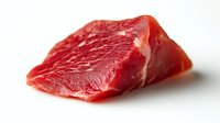 Fresh raw beef steak piece with white marbling on white background, close up view of premium meat cut isolated for food photography and marketing.