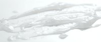 Transparent gel or clear liquid substance with flowing, organic texture isolated on white background, suitable for cosmetics, skincare, and product design applications.