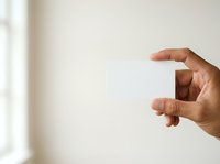 Male hand with medium-dark skin tone making small measurement gesture against neutral background, suitable for business, education, and instructional design projects.